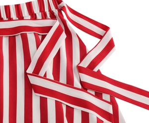 Detailed macro view of elastic waist with matching striped tie belt on A-line skirt