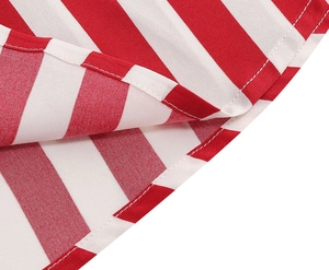 Detailed macro view of the double-needle hem on red and white striped A-line skirt fabric