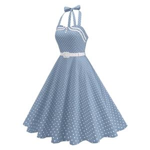 Detail of retro blue polka dot halter neckline with bow tie and button accents