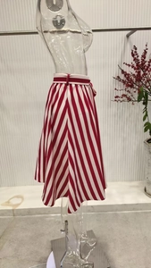 Detail of red and white striped A-line skirt with matching belt on a mannequin