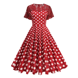 Detail of red polka dot dress featuring elegant lace patchwork and premium mesh texture