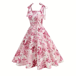Detail of floral printed summer dress featuring adjustable shoulder ribbon bow knots