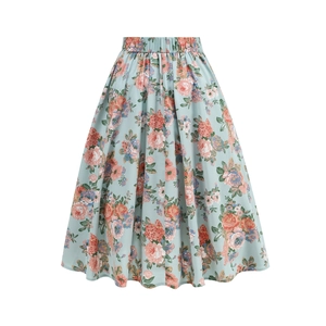 Detail of floral print pattern on a light blue A-line skirt with orange and pink flowers