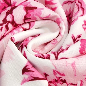 Detail of soft floral print fabric with silky texture and smooth drape