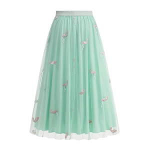 Close-up of pink flamingo embroidery on mint green layered mesh tulle skirt