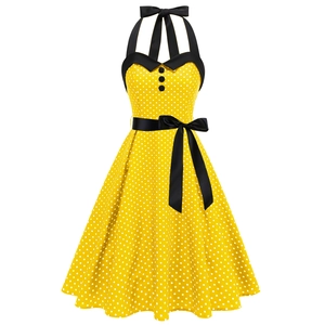 Robe licou rétro jaune à pois avec nœud noir et jupe évasée de style vintage
