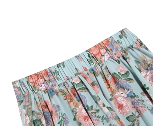 Detail view of the elastic waist band on a light blue floral print A-line skirt