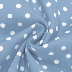 Close-up of light blue cotton fabric with white polka dots showing fine woven texture