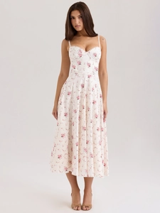 Detail of sweet heart-shaped neckline with white lace trim on floral midi dress