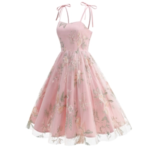 Detail of floral embroidery on pink tulle dress with adjustable shoulder ribbon straps