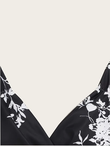 Close-up of the V-neckline and black-and-white floral print on this vintage sleeveless dress