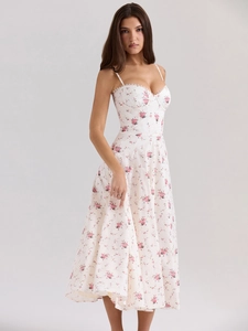 Detail of sweetheart neckline with delicate white lace trim on floral slip dress