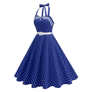 Detail view of navy blue polka dot midi dress with halter neck and white belt