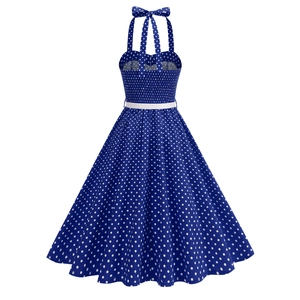 Detailed view of smocked back and halter bow tie on retro blue polka dot dress