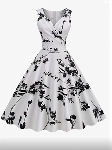 Detail of vintage floral A-line dress featuring a V-neckline and elegant sleeveless design