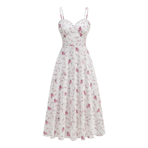 Close-up of pink floral patterns and delicate lace neckline on a white strap dress