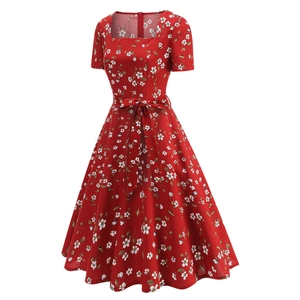Close-up of red floral dress with vintage square neck and bow waist belt detail