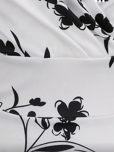 Detailed close-up of vintage black and white floral print on breathable textured fabric