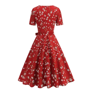 Back view of a red floral midi dress featuring a cinched waist and invisible zipper