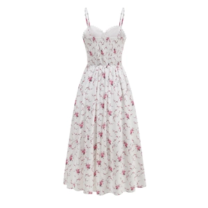 Detail of floral spaghetti strap dress with smocked back and delicate lace trim accents