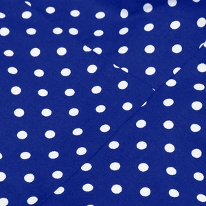 Detail of red and white polka dot fabric texture with pleated folds for A-line dress