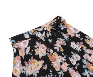 Detail showing high waist tie-bow and floral print on black chiffon midi skirt