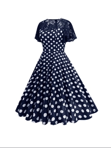 Navy blue vintage polka dot dress with delicate lace sleeves and flared hem silhouette