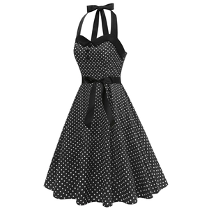 Détail de robe vintage à pois avec licou attaché et nœud de ruban à la taille