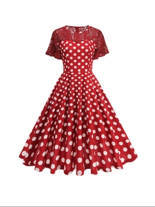 Vintage red polka dot dress with elegant floral lace stitching and a large swing skirt