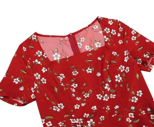 Detailed view of the square neckline and invisible back zipper on red floral dress