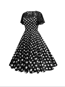 Vintage 1950s Audrey Hepburn style polka dot dress with lace stitching and A-line swing