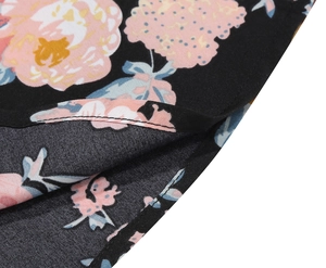 Close-up of floral print fabric with high-quality double stitching on a black A-line skirt