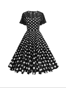 Retro black polka dot dress with elegant lace sleeves and a classic A-line flare skirt