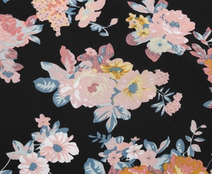 Close-up detail of floral print pattern on a black A-line midi skirt fabric texture