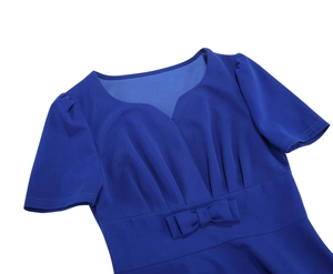 Detail of navy blue V-neck dress featuring sweetheart neckline and waist bow decoration