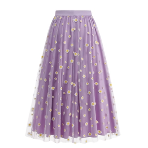 Detail of purple tulle midi skirt with small daisy floral print and elastic waistband