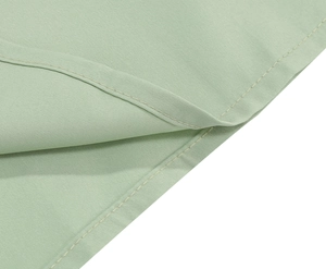 Detailed close-up of mint green embroidered mesh dress showing premium double stitching