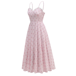 Detail of pink floral dress featuring delicate spaghetti straps and lace trim on neckline