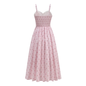 Detail view of the shirred elastic back and pink floral pattern on a summer dress