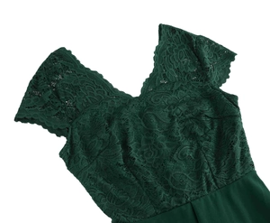 Detailed close-up of dark green V-neck dress featuring delicate floral lace stitching