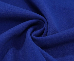 Macro detail of royal blue v-neck dress fabric showing lightweight chiffon texture