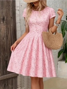 Detail of a pink floral summer dress with short sleeves and vintage floral print patterns