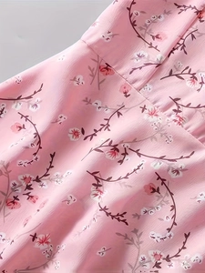 Detail view of the lightweight floral chiffon fabric texture and print on the dress