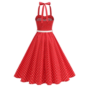 Detail of red polka dot dress featuring elastic shirring back and halter neck tie