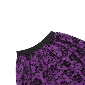 Detail of purple mesh skirt with black velvet floral flocking and elastic waistband