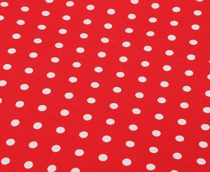 Gros plan détaillé sur la texture du tissu rouge à pois blancs et son tissage