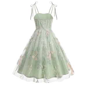 Detail of sage green floral embroidery and mesh layering on the vintage strap dress