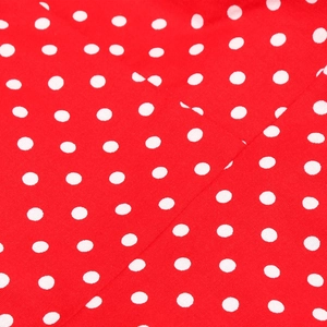 Macro shot of high-quality red cotton fabric with white polka dots texture