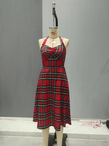 Close-up of halter neck with ruched bust and red plaid pattern on the vintage dress