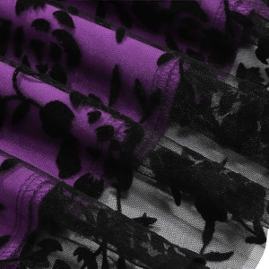Detailed macro view of purple fabric with black floral flocked mesh overlay on 50s skirt